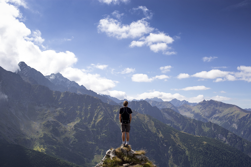 boy standing on mountain